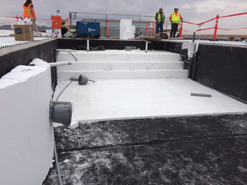 A pool and spa come together using Insulfoam GeoFoam as a fill... with mesh and finished off with shotcrete.