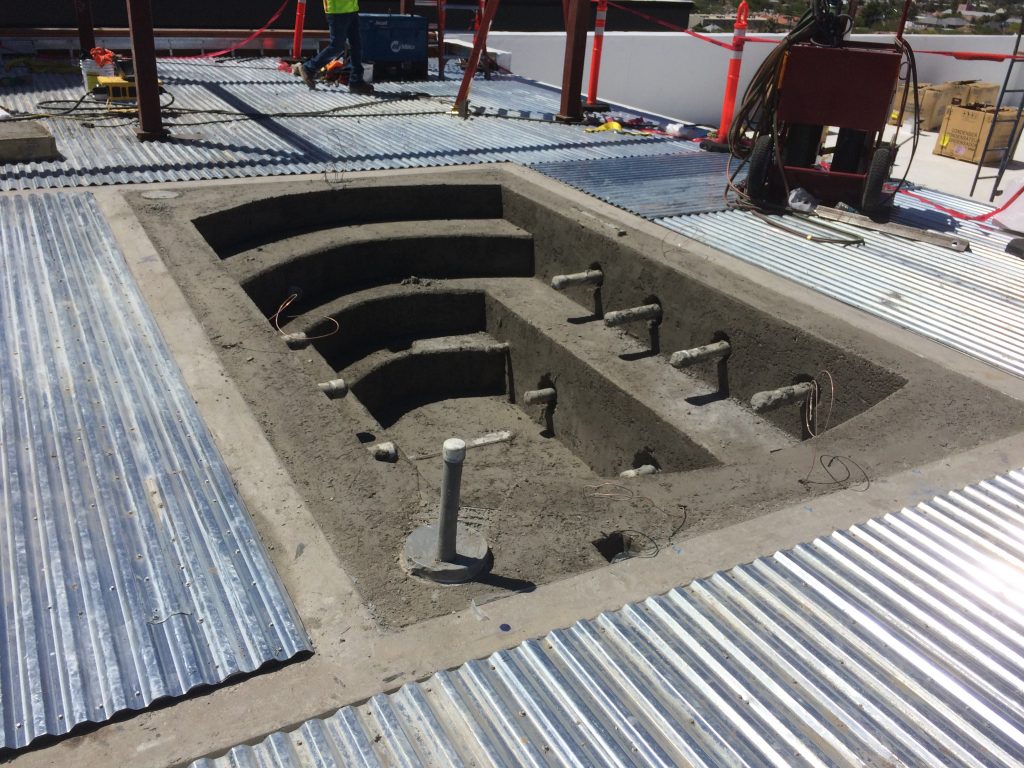 A pool and spa come together using Insulfoam GeoFoam as a fill... with mesh and finished off with shotcrete.