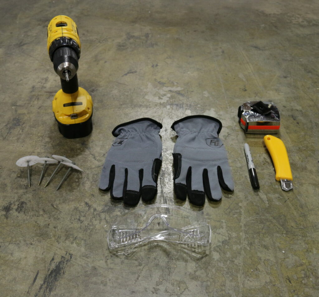 An Image displaying the tools needed to DIY install EPS insulation. Including a drill, screws, gloves, safety glasses, box cutter and a tape measure.